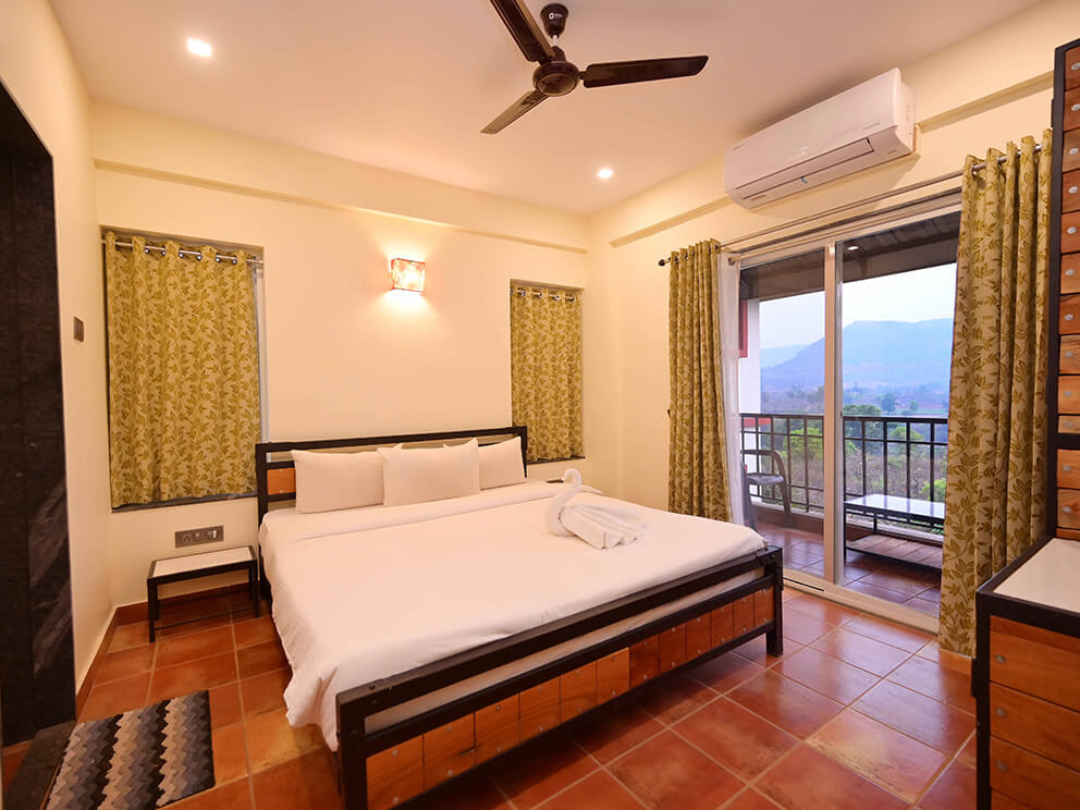 Bedroom with a bed and a balcony